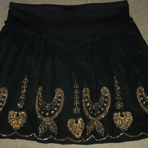 Free People black skirt with gold beading.